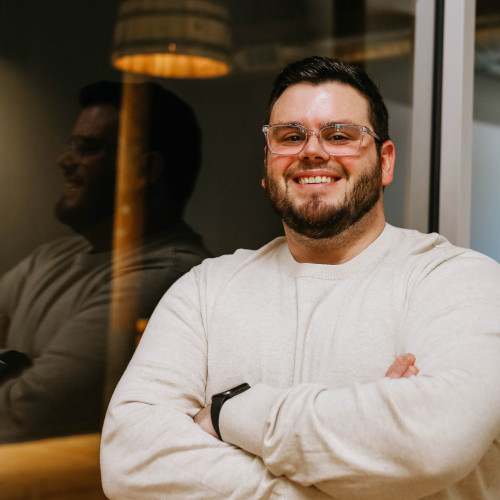 Man smiling toward the camera.